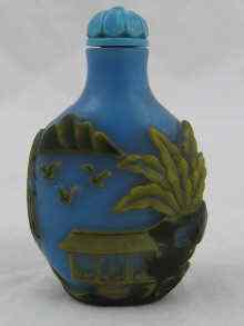 Appraisal: A Chinese green and yellow overlaying blue glass snuff bottle