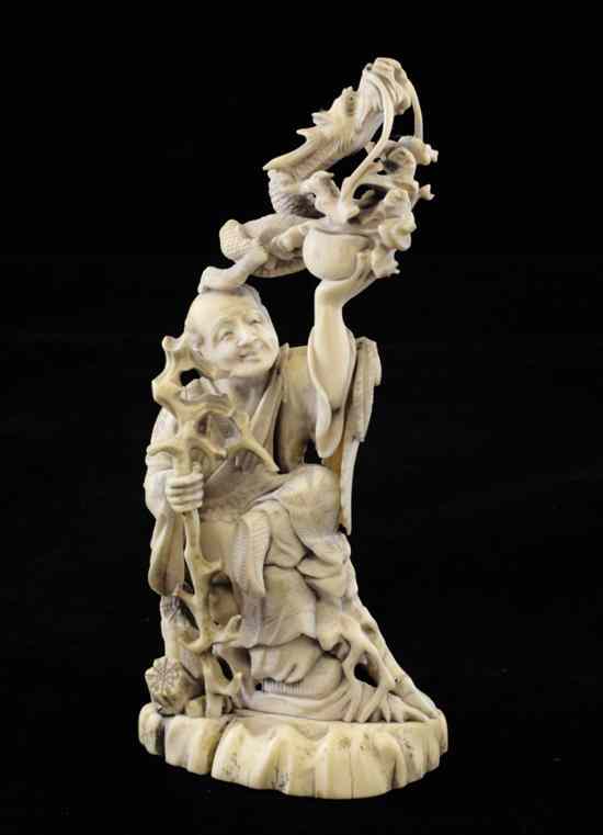 Appraisal: A Japanese sectional ivory and marine ivory figure of a