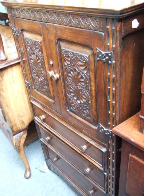 Appraisal: A th century oak cupboard with carved decoration and pair