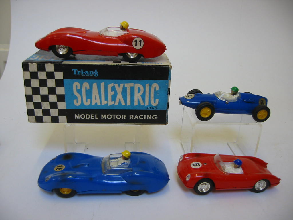 Appraisal: Four Scalextric slot racing cars comprising C Lister Jaguar red