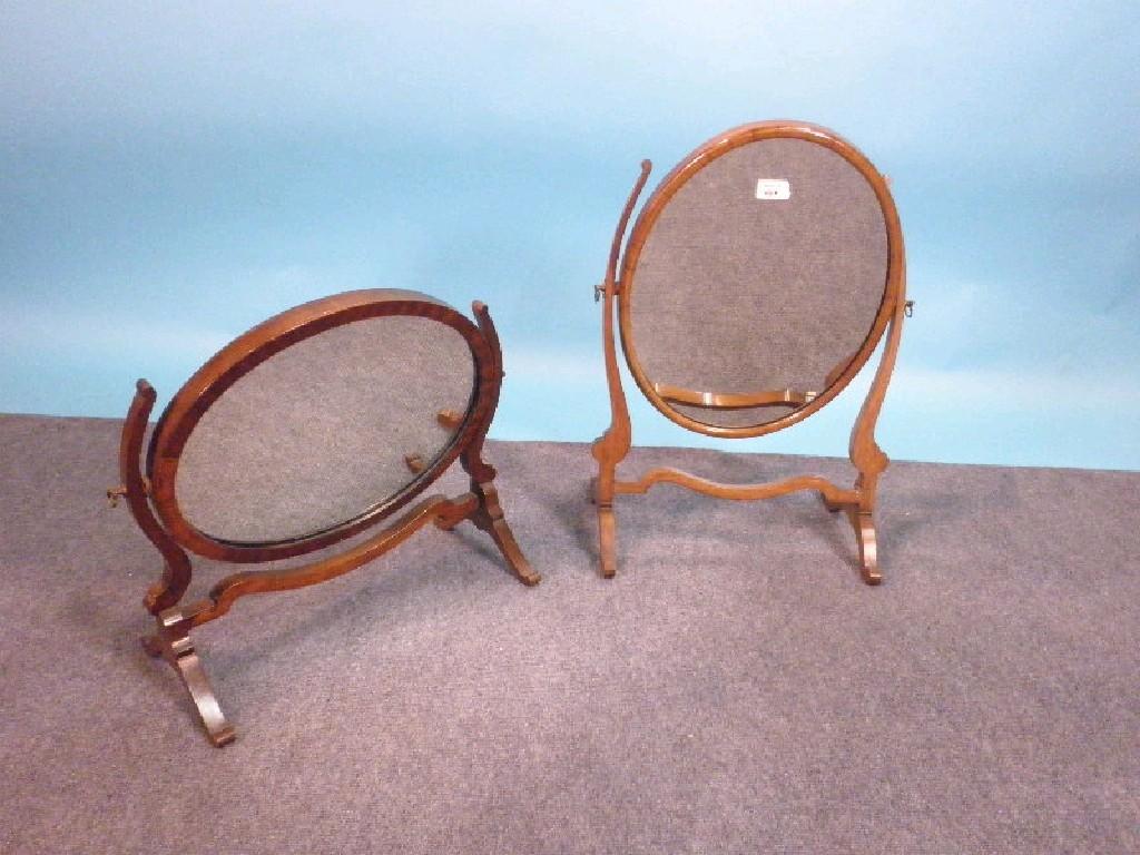 Appraisal: Two mahogany swing frame mirrors each with shaped supports cm