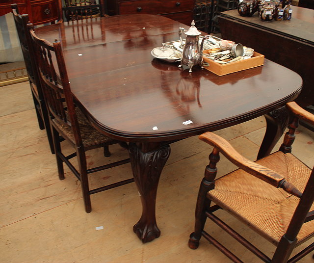 Appraisal: A VICTORIAN MAHOGANY WIND-OUT DINING TABLE with cabriole legs terminating