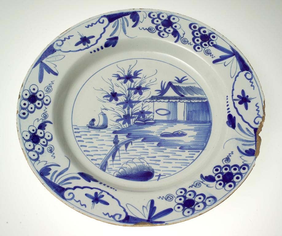 Appraisal: ENGLISH DELFT CHARGER c painted in blue with a figure