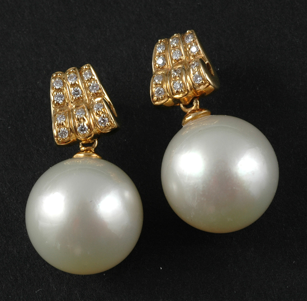 Appraisal: A PAIR OF SOUTH SEA PEARL AND DIAMOND EARRINGS Each