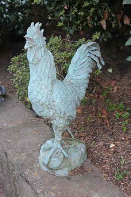 Appraisal: A BRONZE SCULPTURE of a striding cockerel high