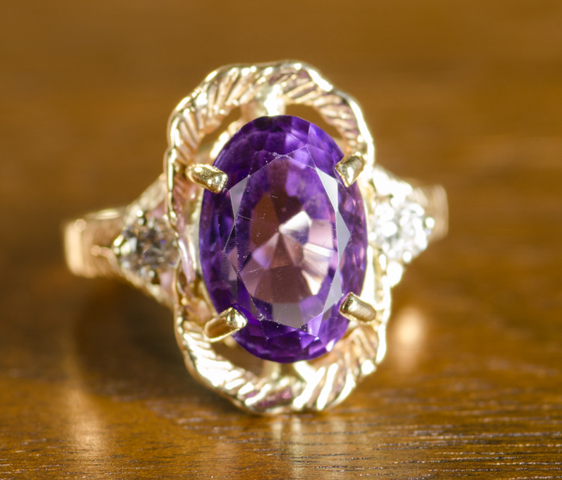 Appraisal: AMETHYST DIAMOND AND FOURTEEN KARAT GOLD RING with two round-cut