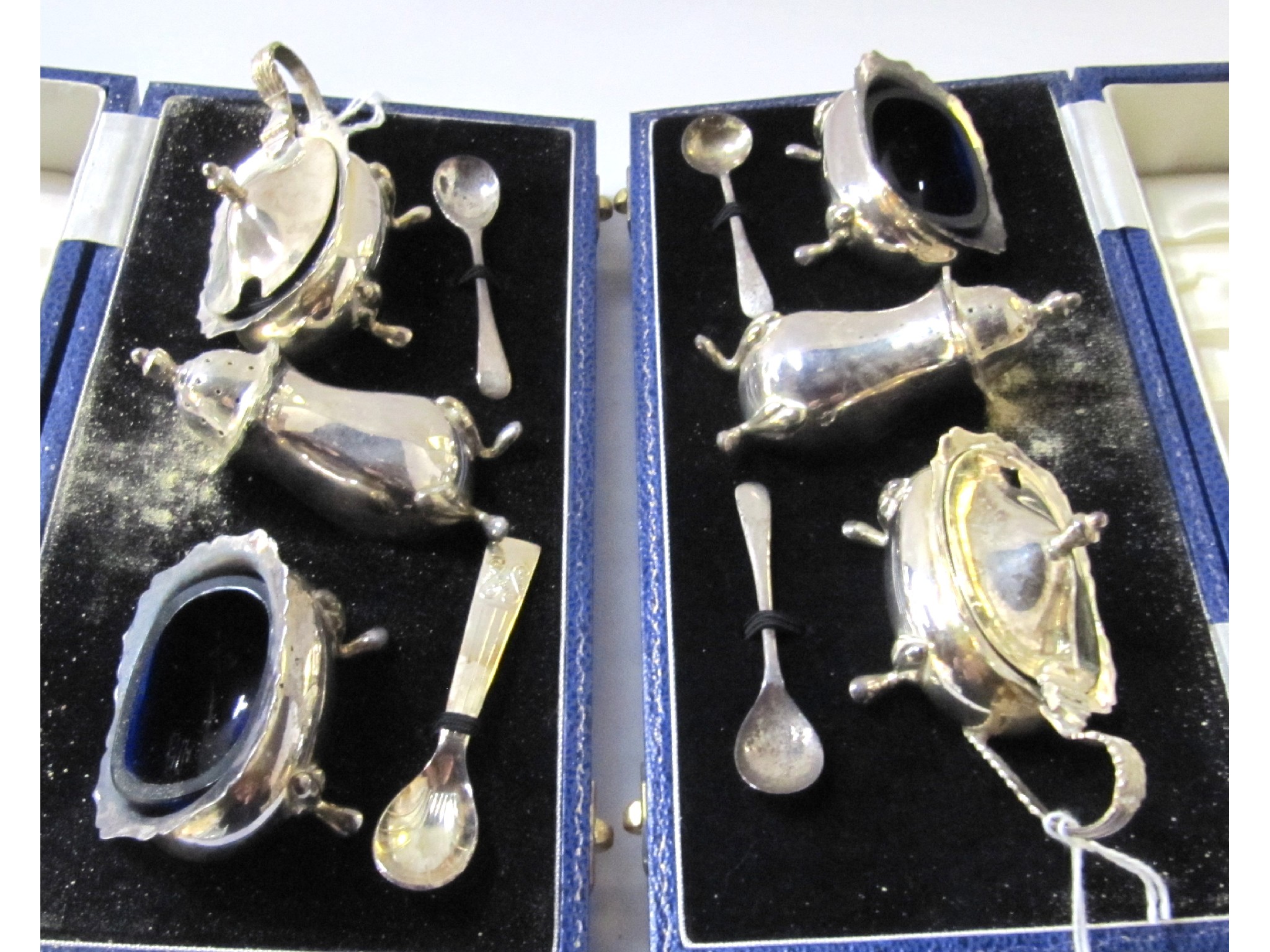 Appraisal: A lot comprising two cased three piece silver condiment sets