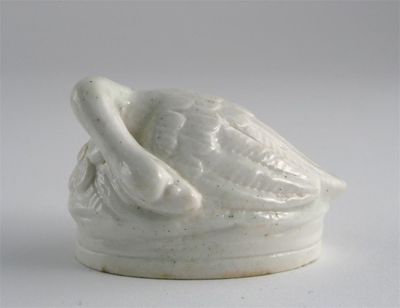 Appraisal: A French porcelain white-glazed box formed as a sleeping swan