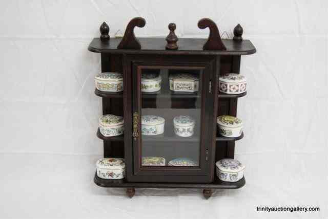 Appraisal: Franklin Porcelain Music Box CollectionIncludes music boxes and the mahogany