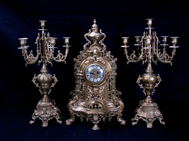 Appraisal: Italian Cast Metal Clock Garniture gold overlay with German made