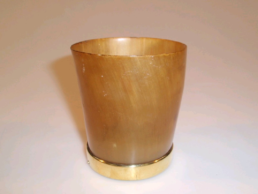 Appraisal: A horn beaker with brass foot rim with wooden base