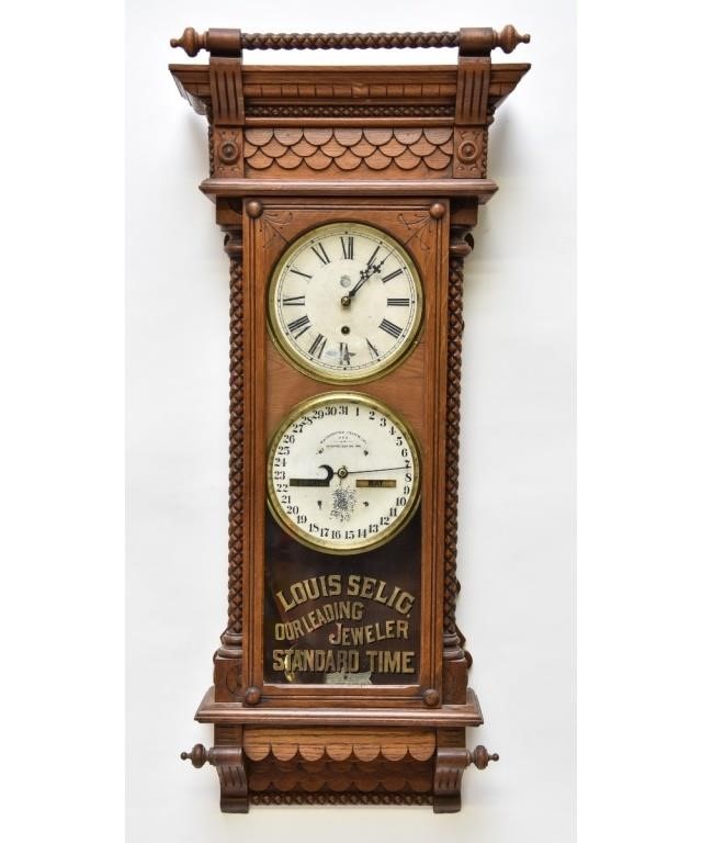 Appraisal: Waterbury Clock Company double dial walnut advertising wall clock h