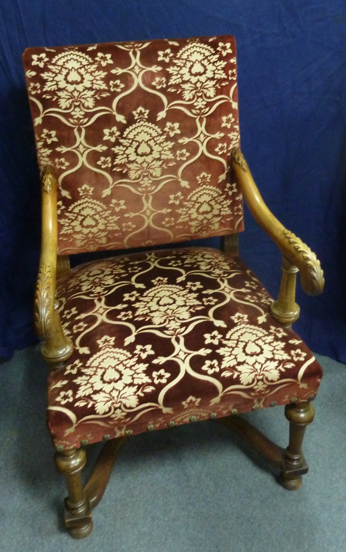 Appraisal: An upholstered armchair of Carolean design the walnut frame with