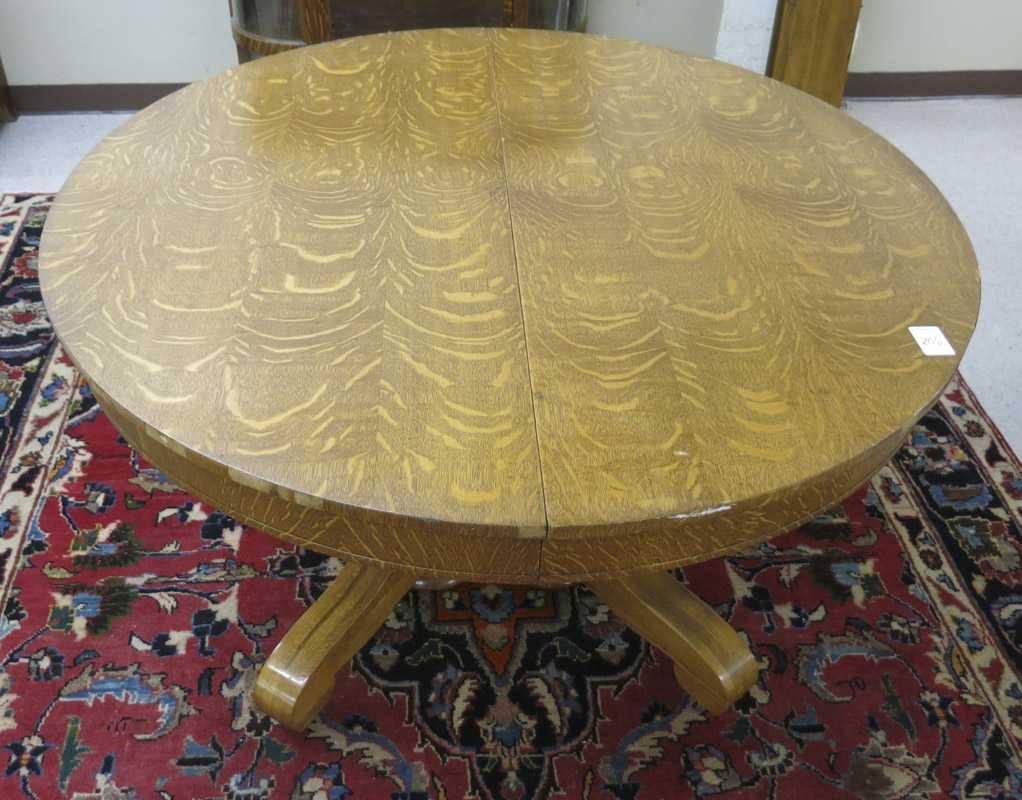 Appraisal: ROUND OAK DINING TABLE WITH SIX LEAVES Empire Revival style