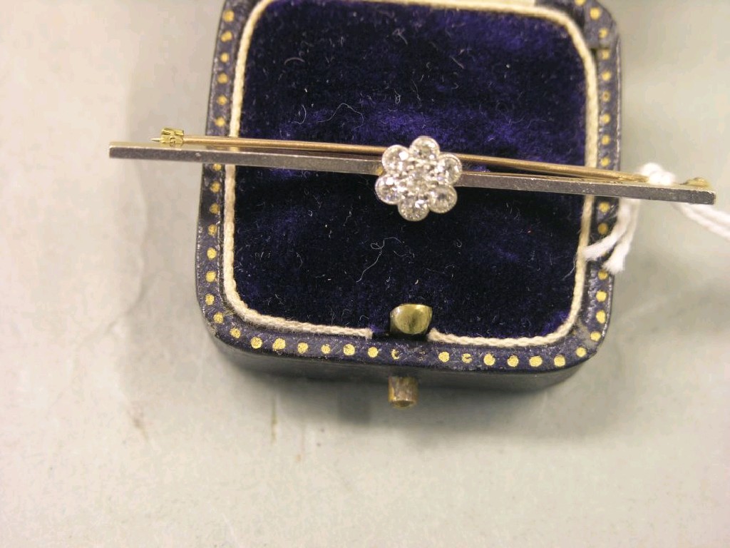 Appraisal: A ct gold and diamond bar brooch seven small diamonds