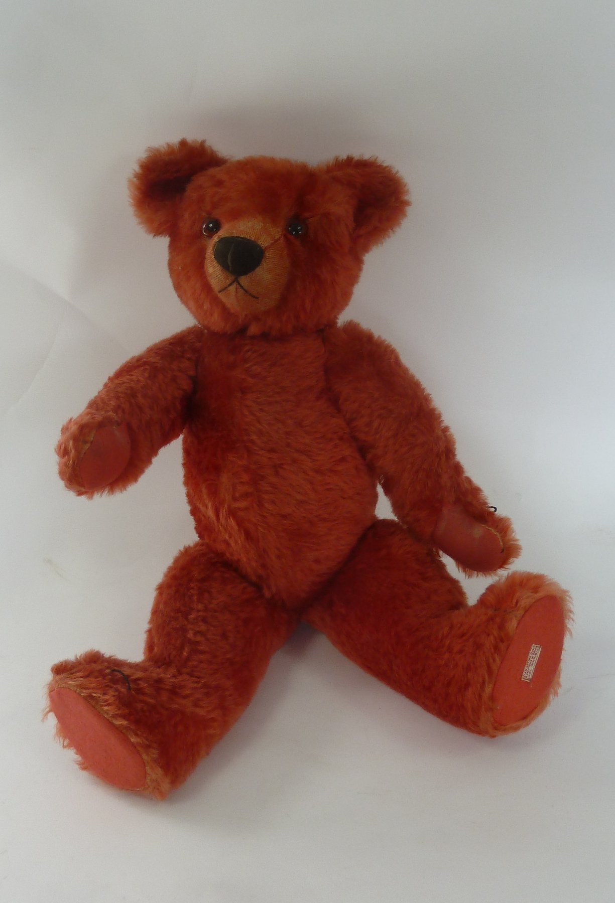 Appraisal: A Chad Valley teddy bear with growler and rust coloured