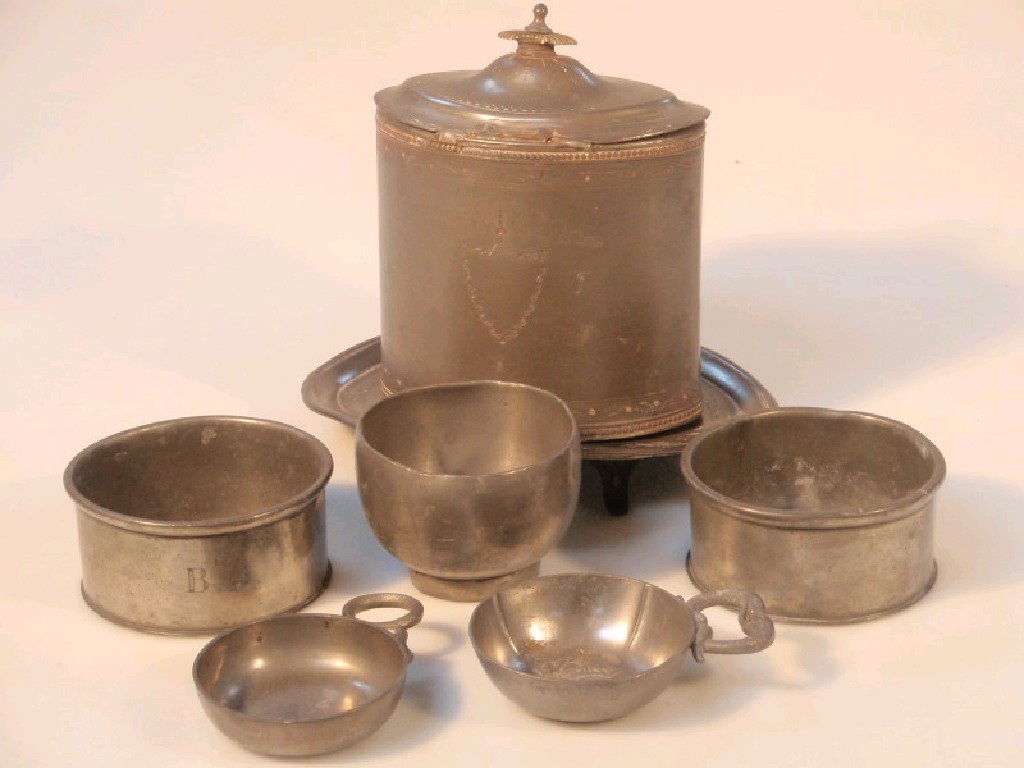 Appraisal: An thC pewter oval tea caddy and stand dipping cup