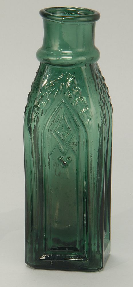 Appraisal: RARE GOTHIC-FORM BLOWN MOLDED GLASS BOTTLE In emerald green Height