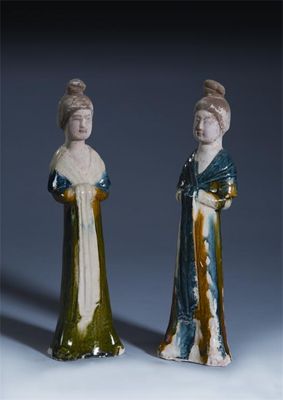 Appraisal: A pair of Chinese pottery blue sancai-glazed models of maidens