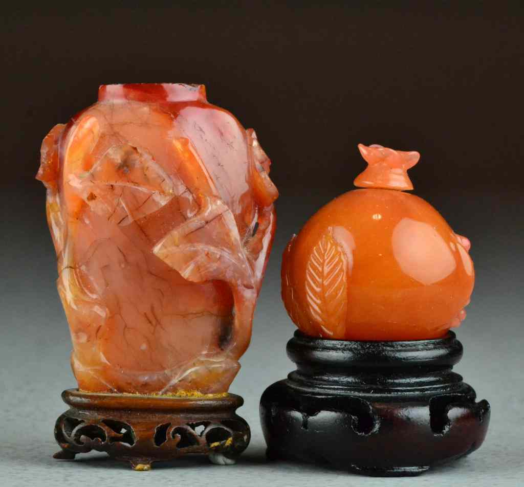 Appraisal: Chinese Qing Carved Agate Snuff BottlesOne carved to depict a