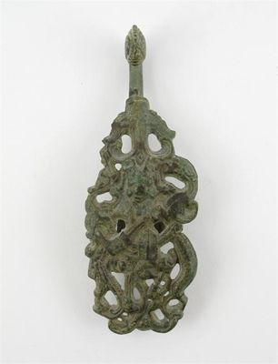 Appraisal: A Chinese bronze buckle reticulated and cast with Ch'ih Yu