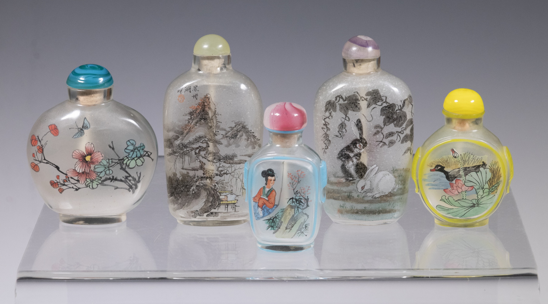 Appraisal: CHINESE REVERSE PAINTED SNUFF BOTTLES Lot of all with lids