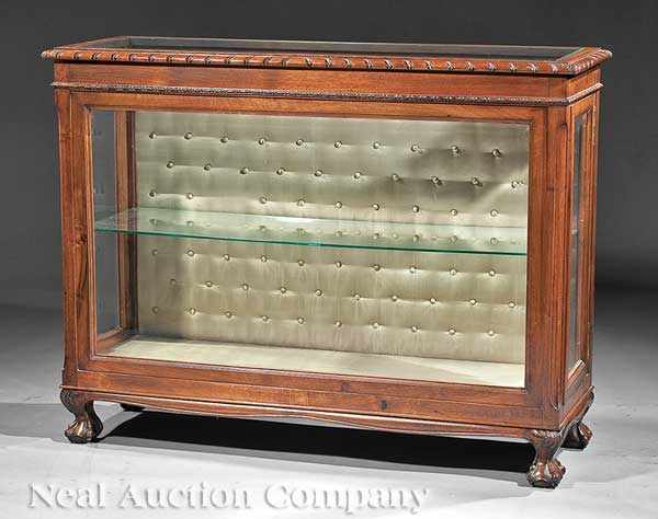 Appraisal: An Antique English Carved Walnut Vitrine glazed top shelf interior