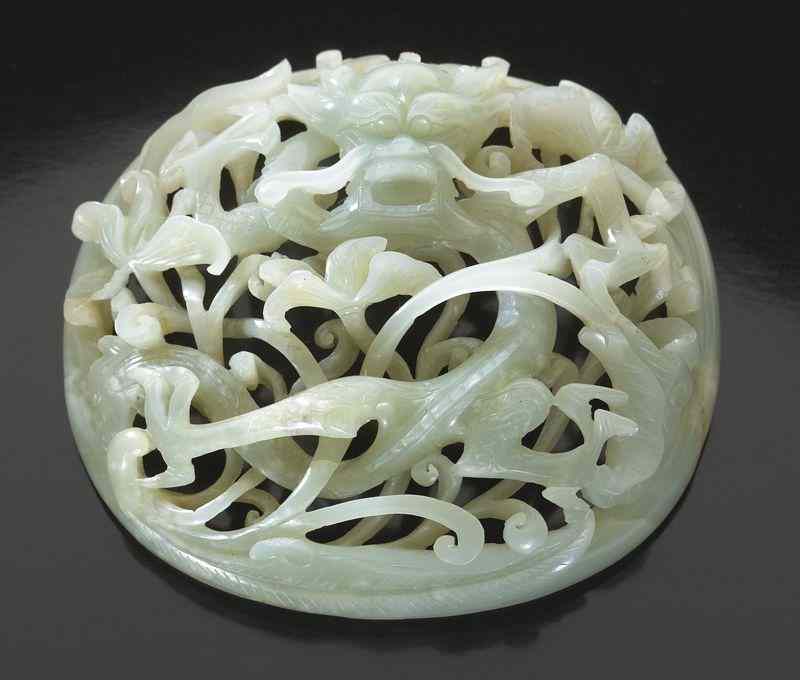 Appraisal: Chinese Ming carved openwork jade plaquedepicting dragons and lotus ''H