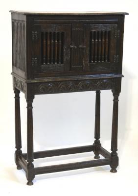 Appraisal: AN OAK LIVERY CUPBOARD of oblong form with moulded edged