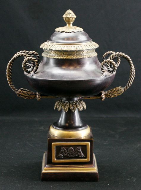 Appraisal: A bronze urn and cover on pedestal cms high