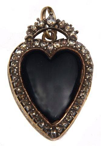 Appraisal: A VICTORIAN ENAMELLED AND DIAMOND SET HEART SHAPED LOCKET with