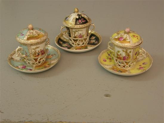 Appraisal: Two Dresden twin-handled chocolate cups and covers on trembleuse saucers