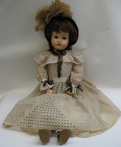 Appraisal: GERMAN PAPIER MACHE GIRL DOLL in brown wig brown sleep