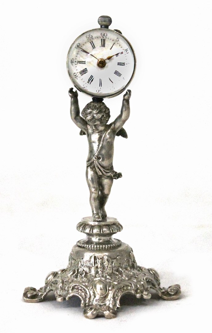 Appraisal: A small clock formed as the standing figure of a