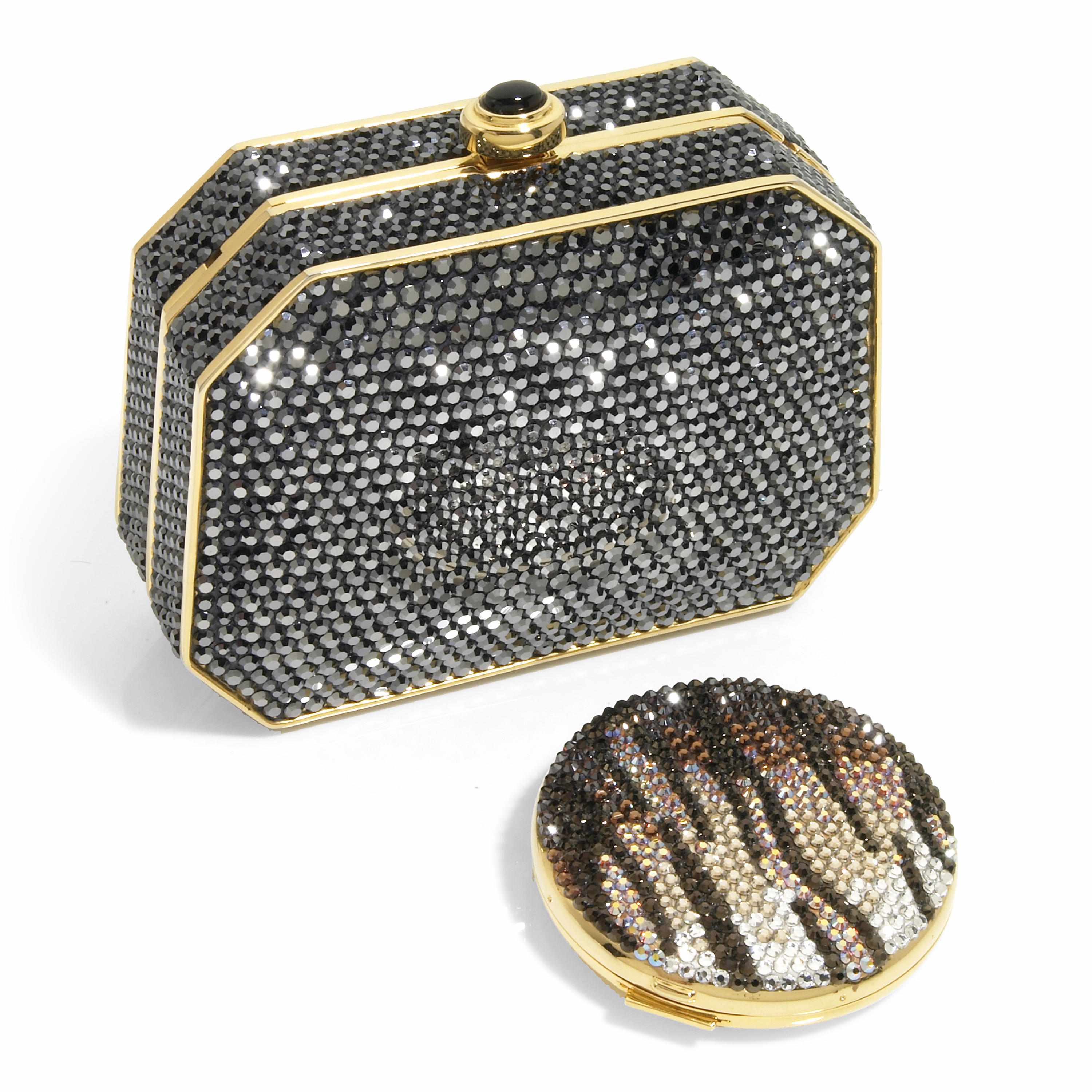 Appraisal: A charcoal crystal purse with indented edges and gold colored