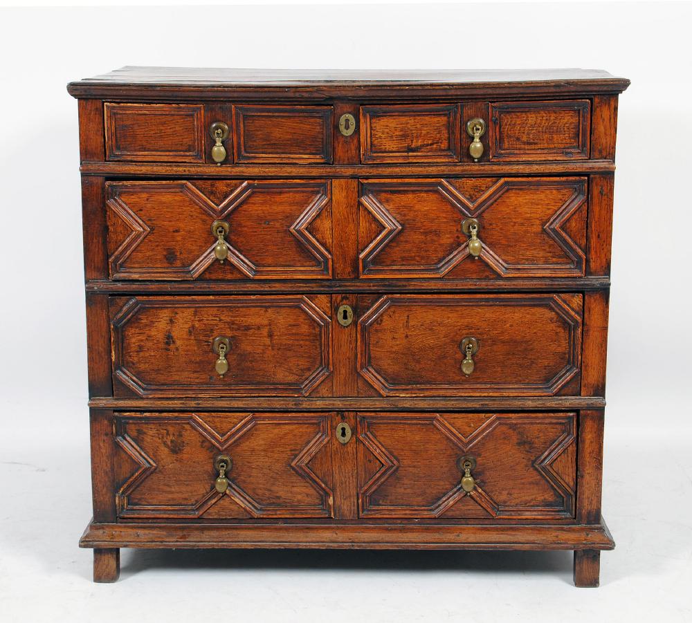 Appraisal: AN OAK GEOMETRICALLY MOULDED CHEST c the moulded edged plank