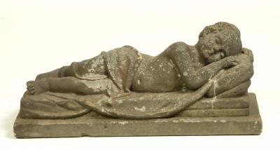 Appraisal: A VICTORIAN CARVED STONE FIGURE modelled as a sleeping cherub