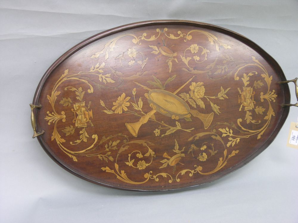 Appraisal: A th century mahogany and marquetry tray oval shape with