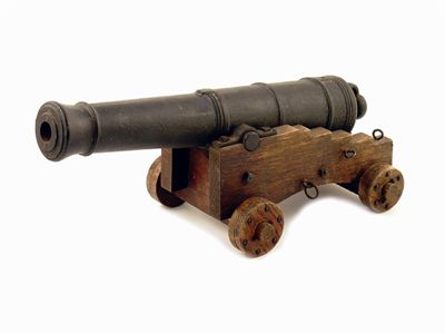 Appraisal: An iron model cannon on an oak carriage in cm