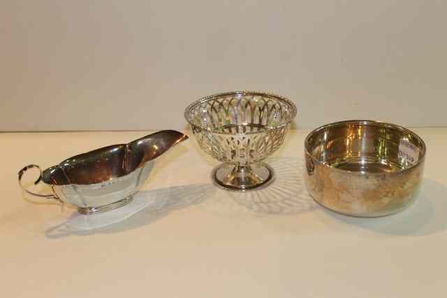 Appraisal: AN OPEN SILVER BOWL of plain form together with an