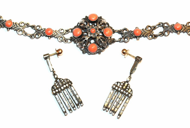 Appraisal: A VICTORIAN SILVER AND CORAL SET BRACELET with pierced foliate