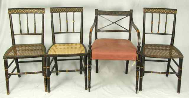 Appraisal: A Regency black painted and gilt decorated armchair on turned