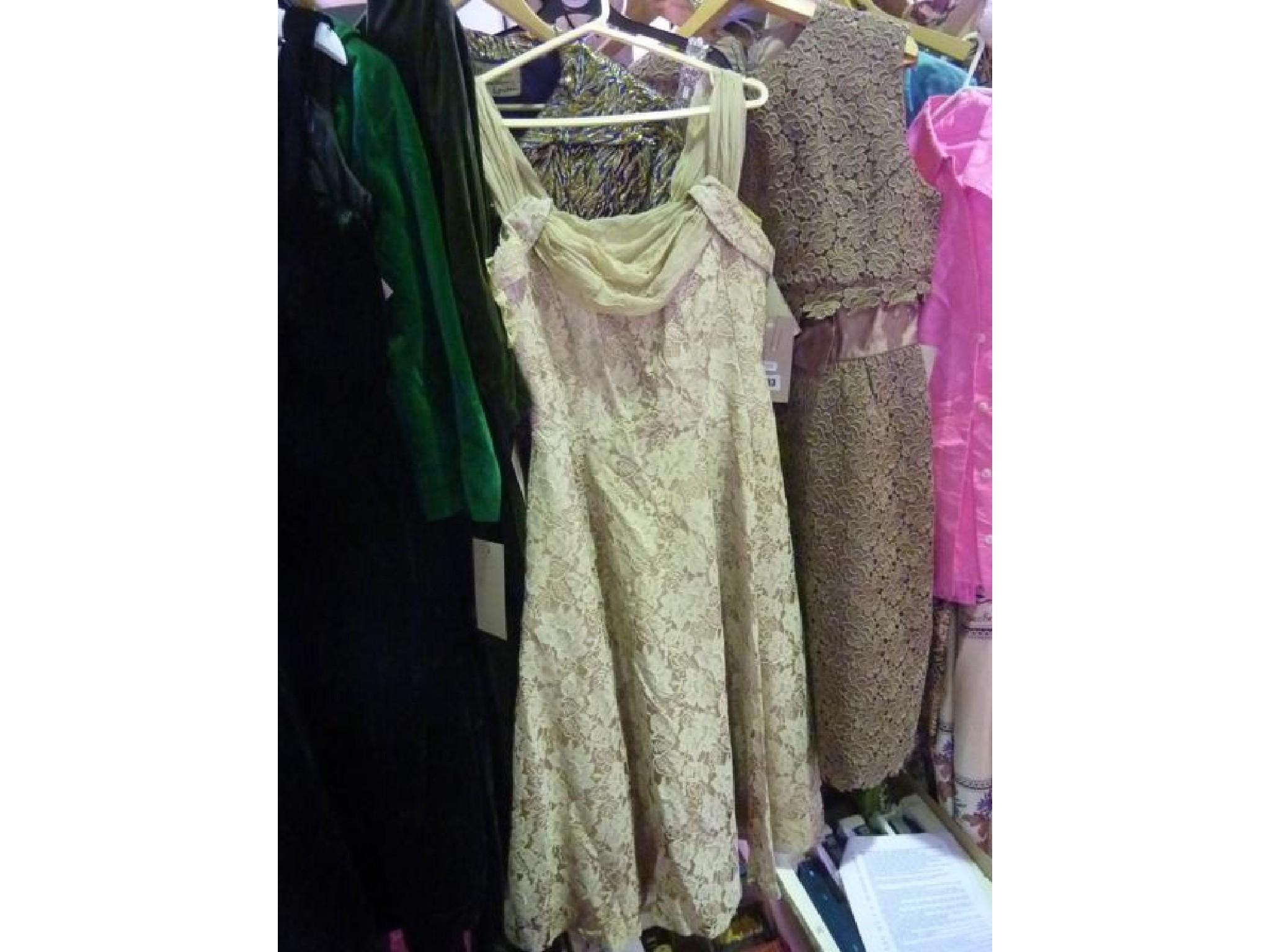 Appraisal: A quantity of ladies dresses including a coffee coloured lace