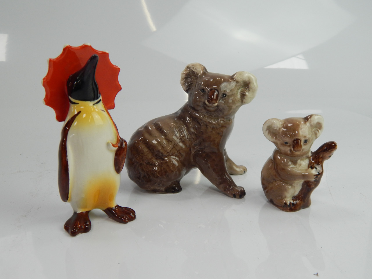 Appraisal: Three Beswick pottery figures two koala bears and a penguin