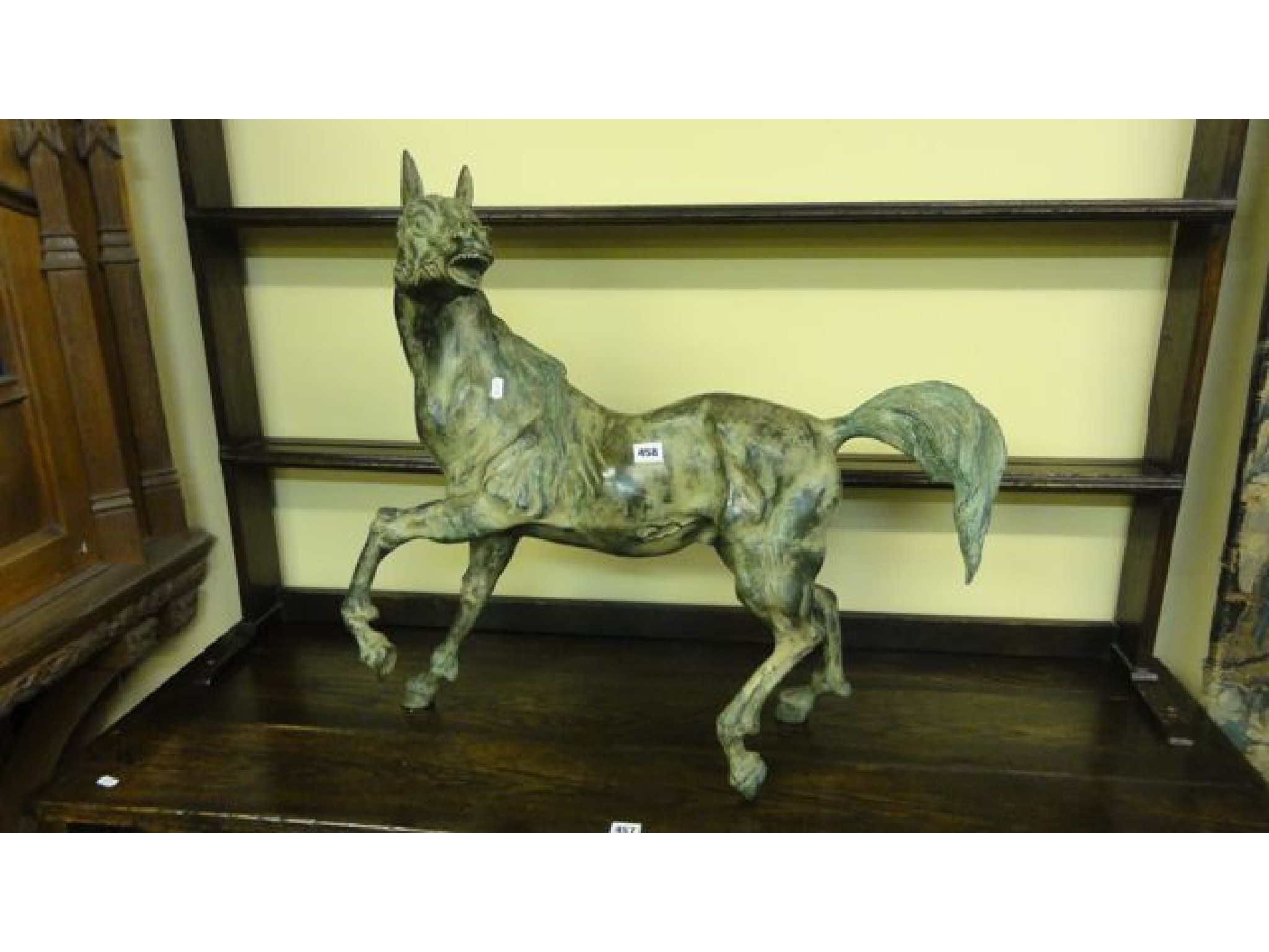 Appraisal: A bronze figure of an energetic lean stallion cm maximum