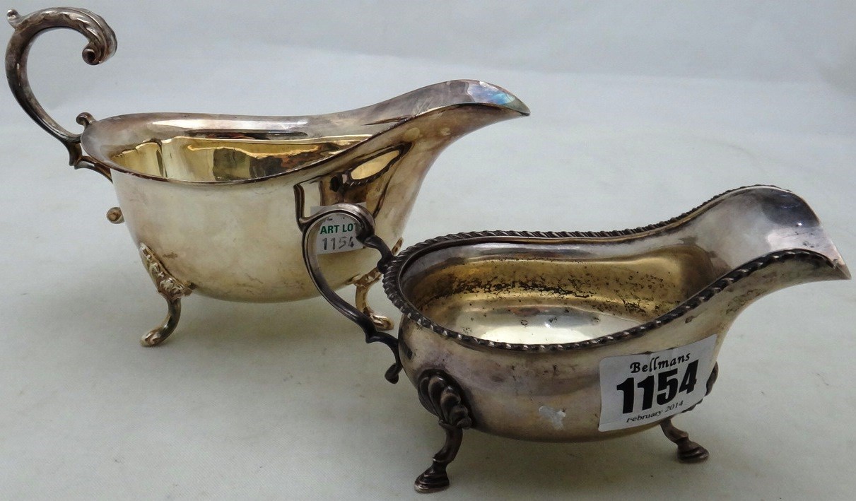 Appraisal: A silver sauceboat with a gadrooned rim raised on three