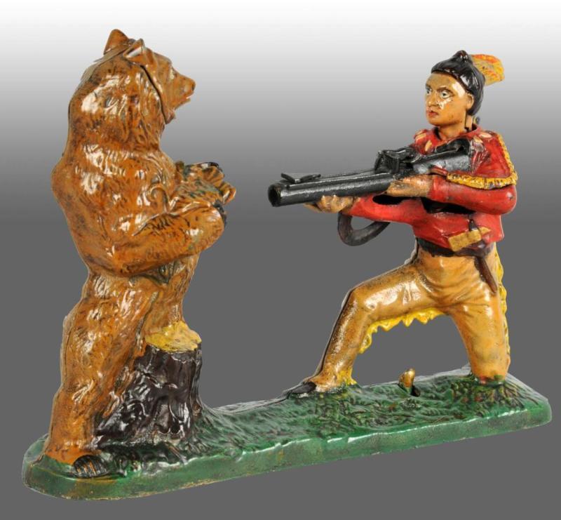 Appraisal: Cast Iron Indian and Bear Mechanical Bank Description Manufactured by