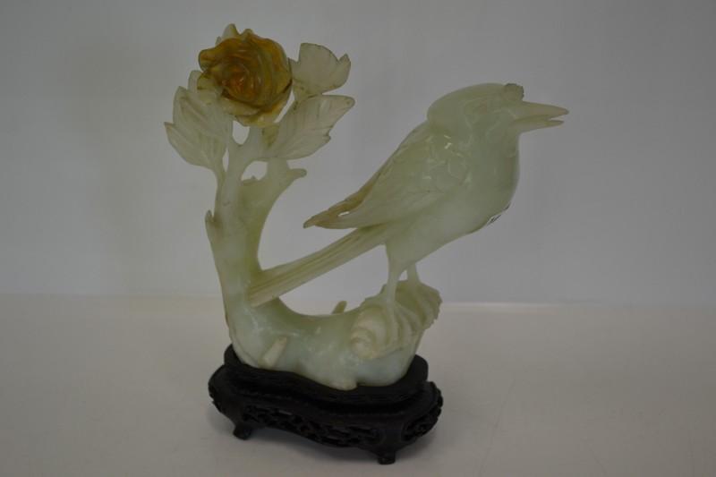 Appraisal: JADE CARVING OF A BIRD ON PIERCED WOODEN BASE