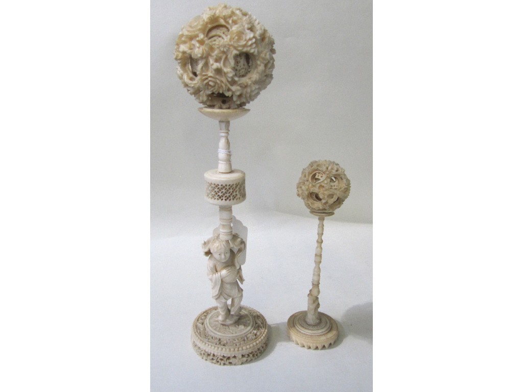 Appraisal: Lot comprising two ivory puzzle balls on stands