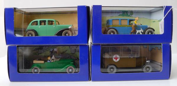 Appraisal: FOUR EN VOITURE TINTIN FIGURES FROM TINTIN COMICS RELEASED IN